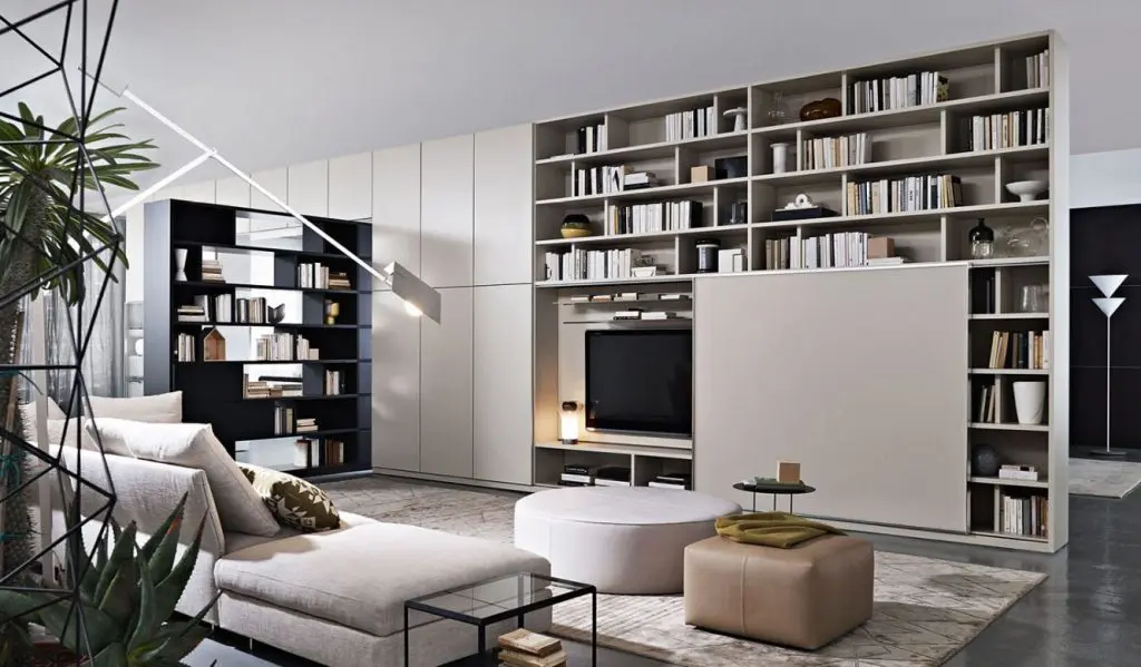 Molteni & C 505 modular bookshelf system with a TV unit, beige sofa and potted plants in a contemporary living room