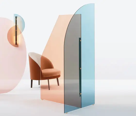 Orange upholstered armchair beside a folding glass screen in pink and blue panes