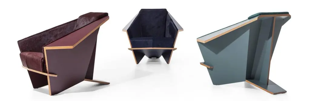 Three angular wood and upholstered lounge chairs shown from different sides