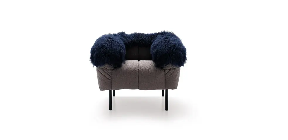 Arflex Pecorelle armchair with dark blue shaggy sheepskin arm cushions