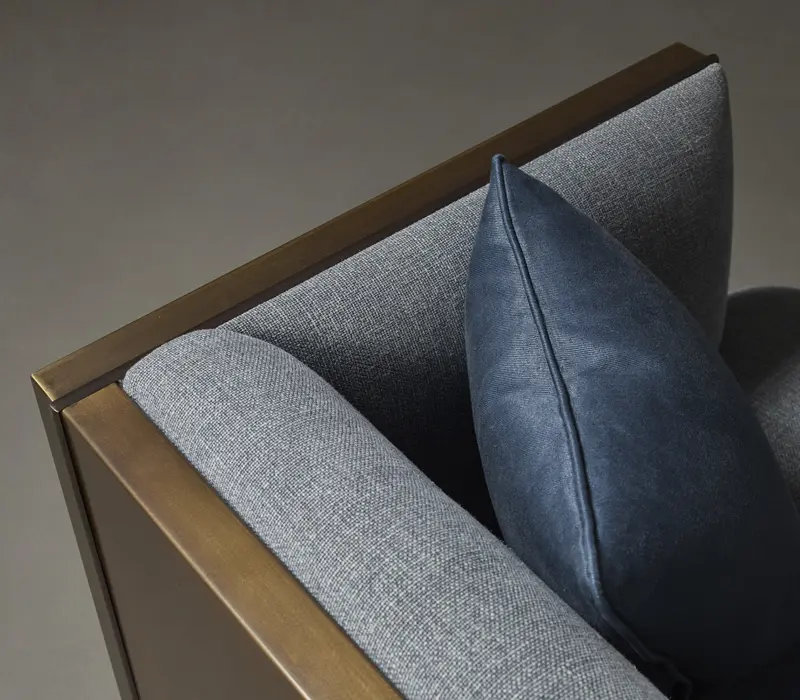 Italian Furniture in London and 12 Best Italian Furniture Stores in London featuring a detail shot of the Promemoria furniture brand's Boccaccio Sofa in Bronze