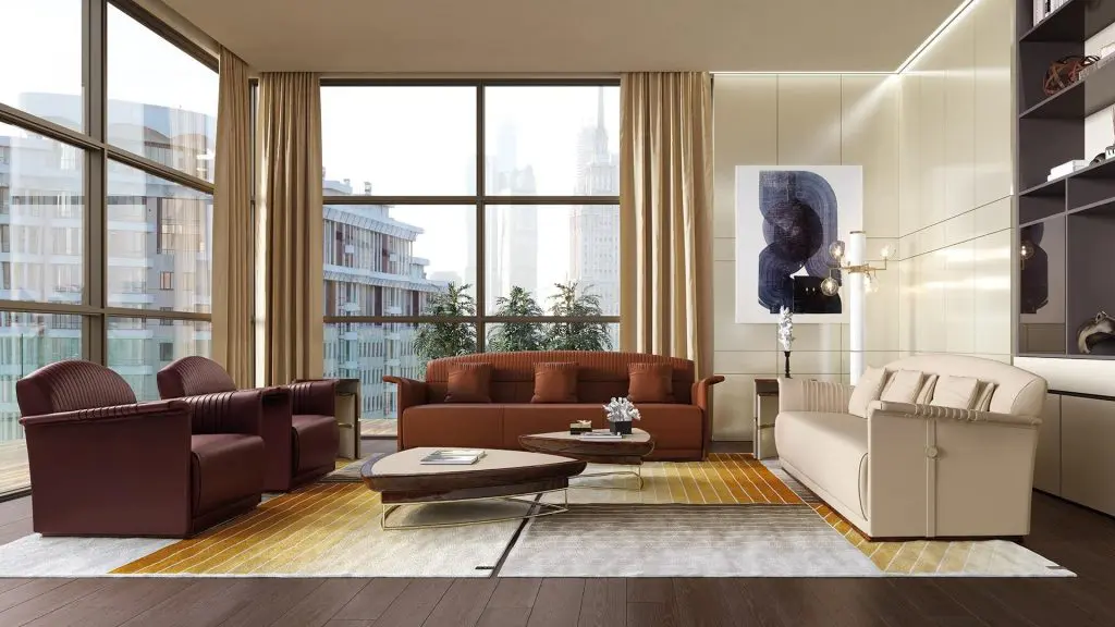 Turri living room with burgundy leather armchairs, a terracotta sofa and a cream sofa by floor-to-ceiling city-view windows