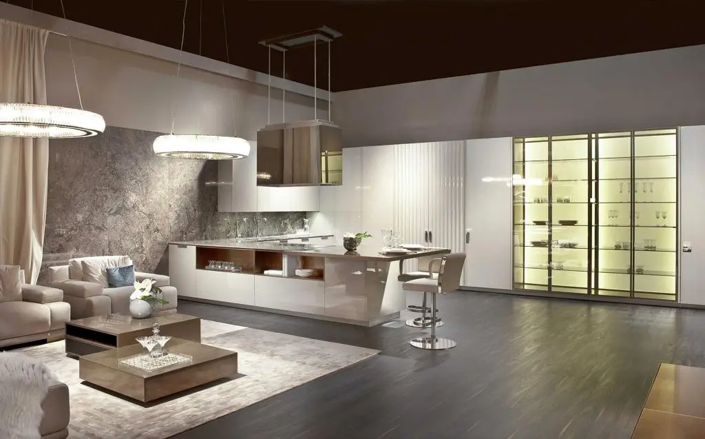 Fendi Casa kitchen with a glossy cream island, illuminated glass display cabinets and round pendant lights