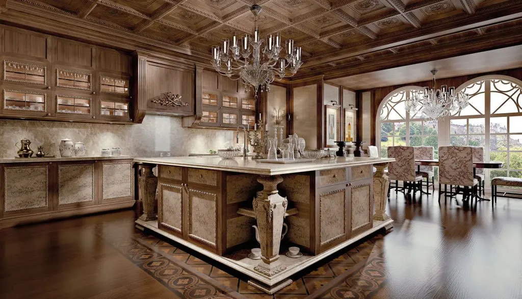 Provasi classic kitchen with a carved wood island, marble countertop and crystal chandeliers