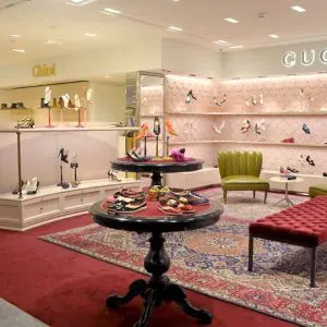 Chloe and Gucci shoe displays in a boutique