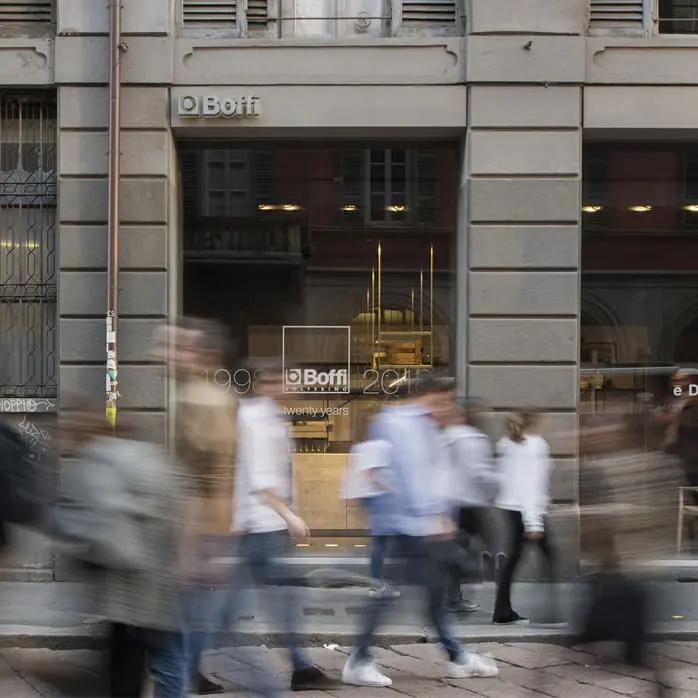 Boffi furniture storefront with pedestrians walking past in motion blur