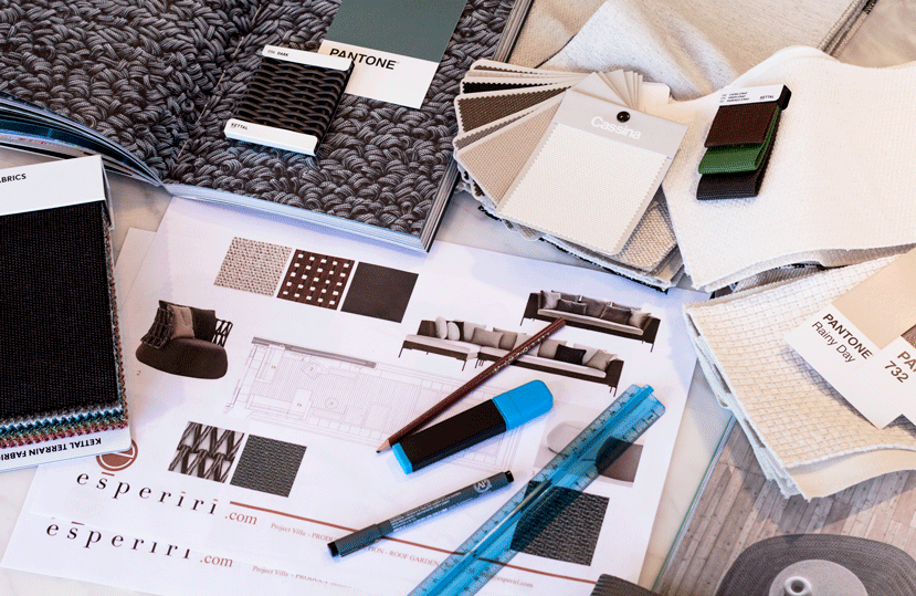 flat lay of fabric swatches, Pantone color cards and a furniture catalog
