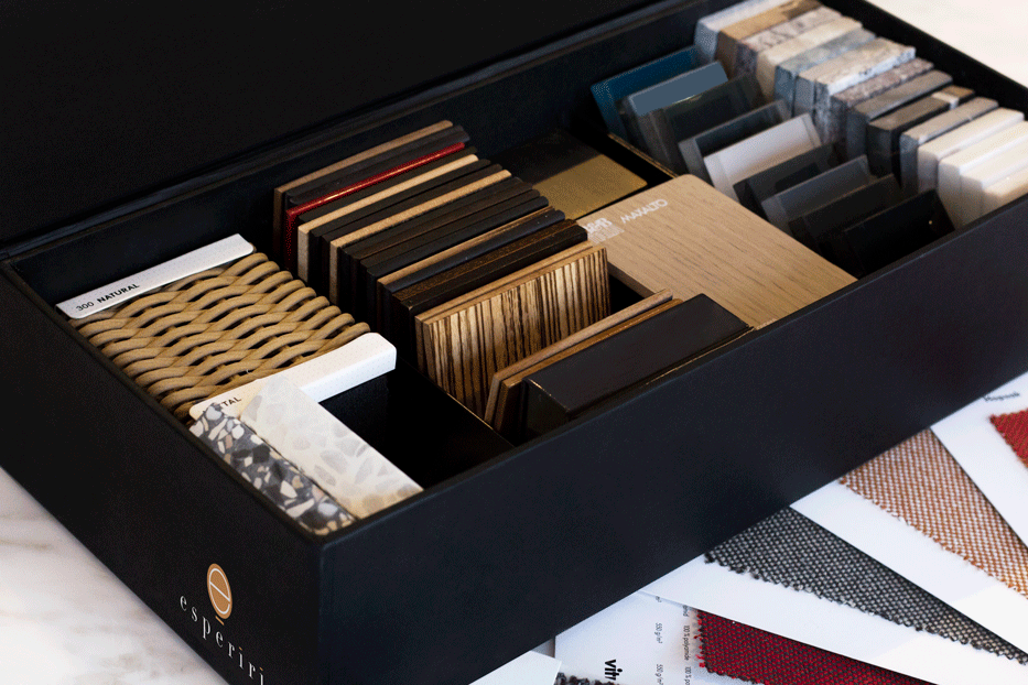 Open sample box of wood, stone and fabric material swatches