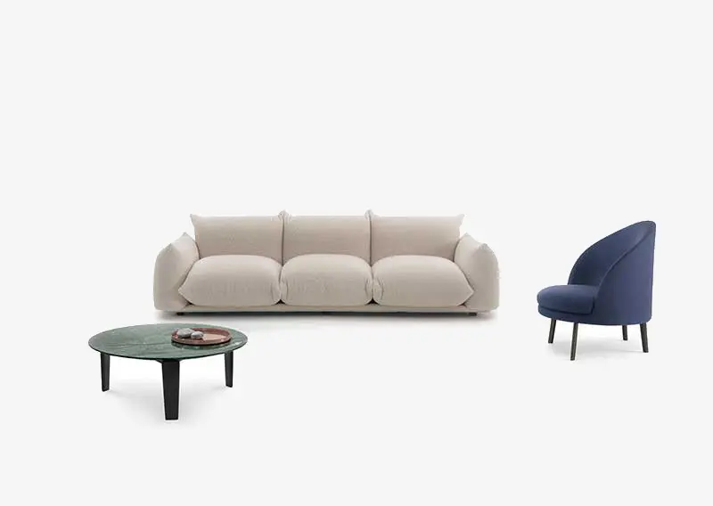 Beige upholstered sofa, green marble coffee table and navy blue accent chair