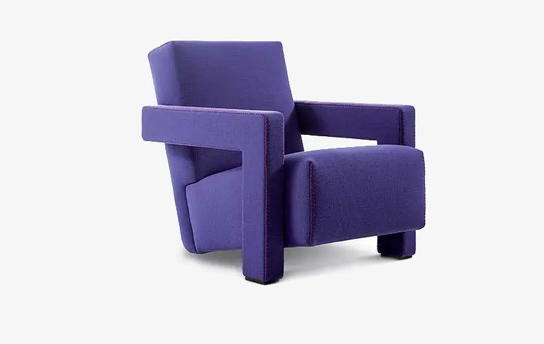 purple upholstered armchair with wooden legs on a white background