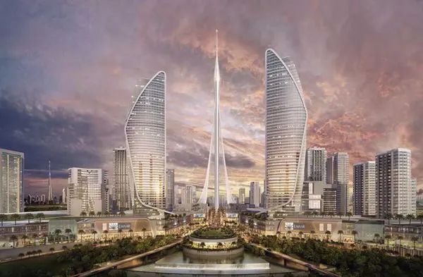 Rendering of a Dubai skyline with fan-shaped towers and a central spire at sunset