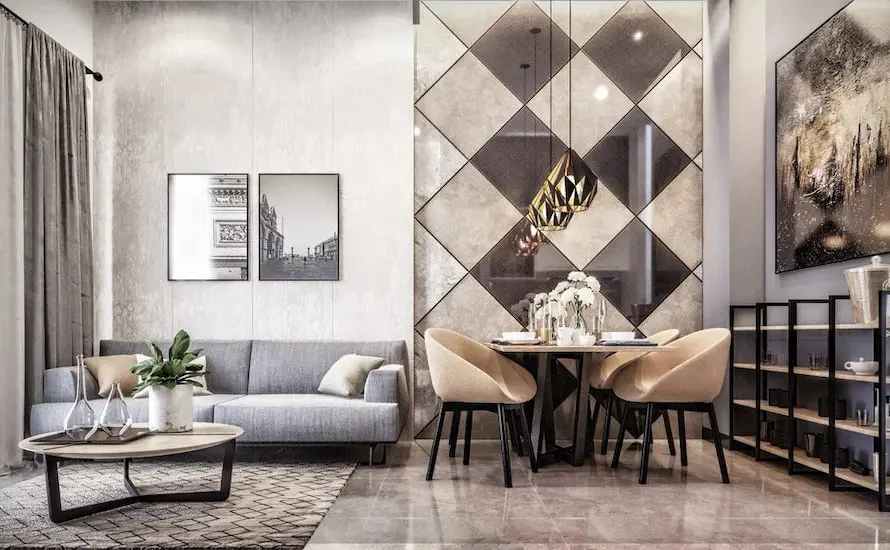 Living and dining room with a diamond-pattern mirrored accent wall and pendant lights