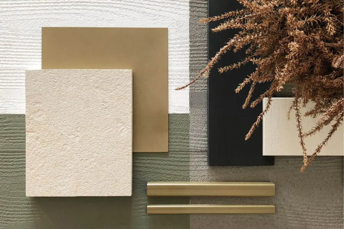 Moodboard with textured plaster, stone, brass profiles and dried grasses