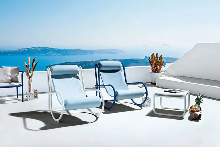 solus armchair by exteta in a terrace with a seaview