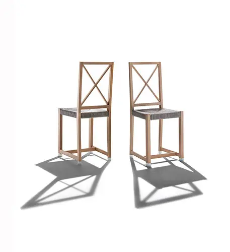 Pair of teak outdoor chairs with an X-back frame and woven seats
