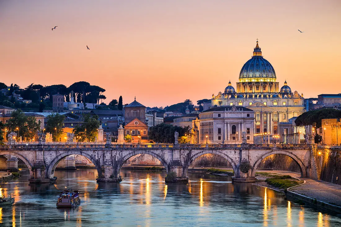 St Peter's Basilica and the Tiber in Rome at sunset