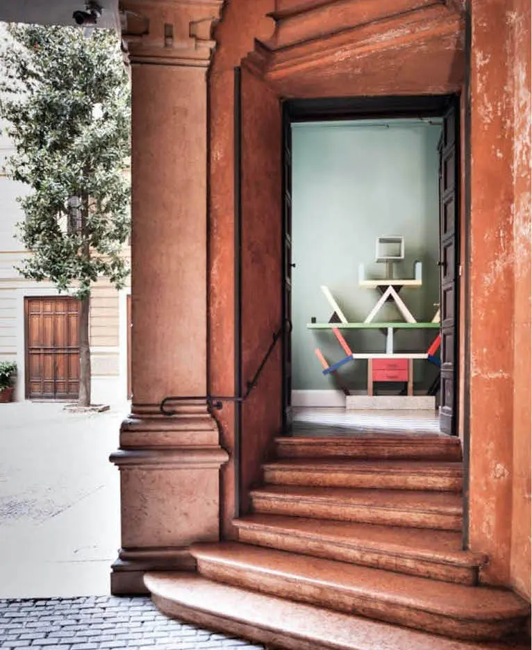 Doorway with red stone steps leading into a showroom