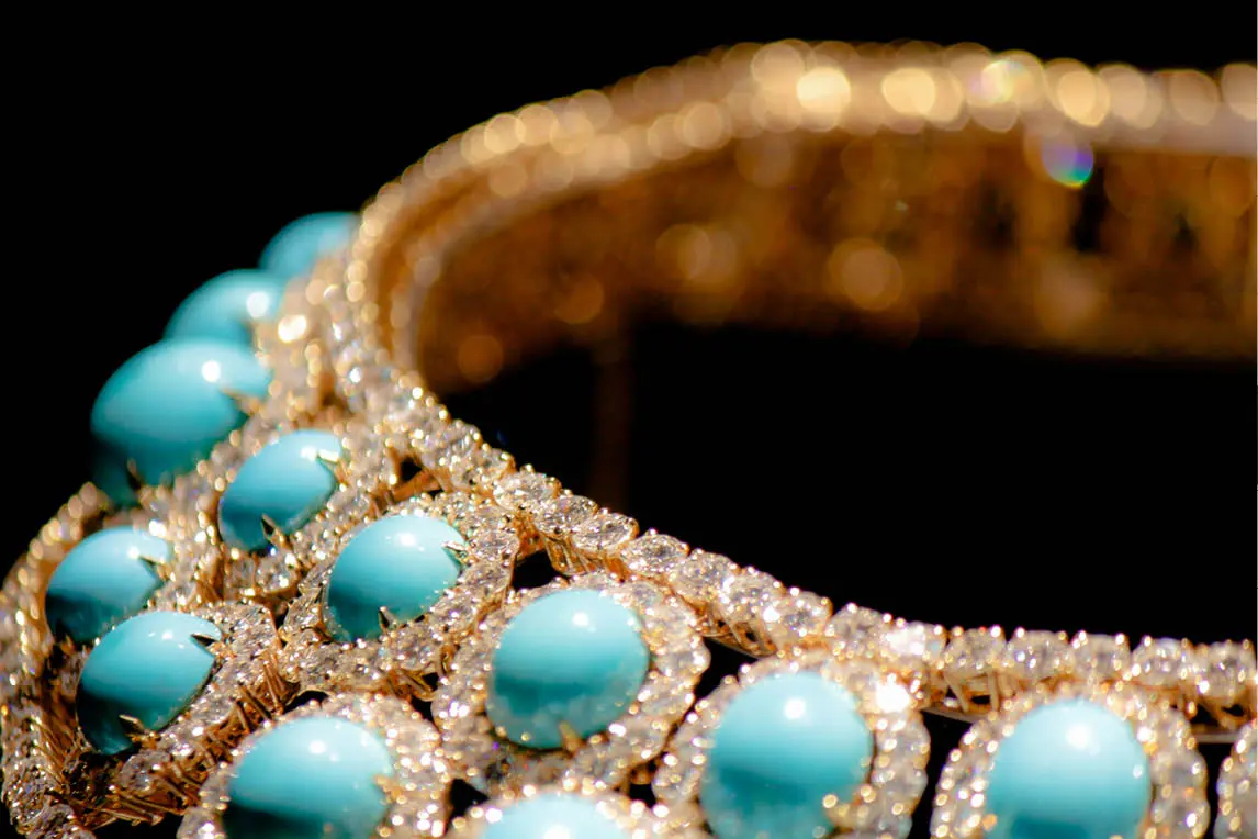Gold bracelet set with turquoise stones and diamonds