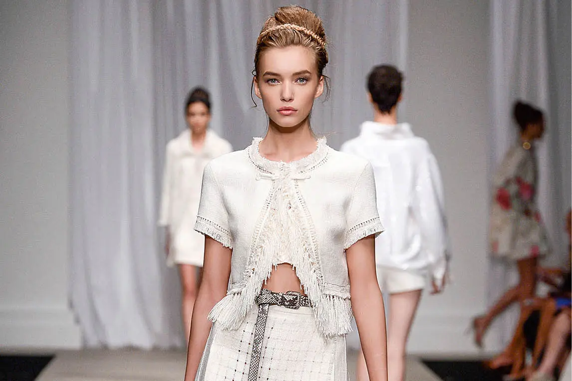 Models walking a fashion show runway