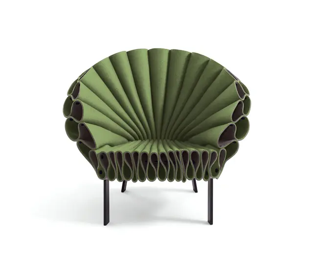 Green pleated felt armchair with a fanned petal-like backrest
