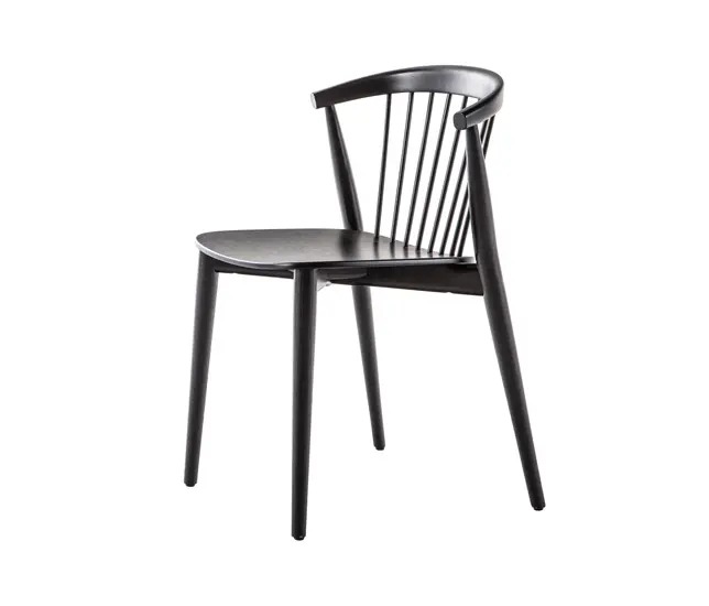 Black wood dining chair with a spindle back on a white background