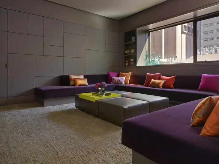 new york apartment interior with purple sofa