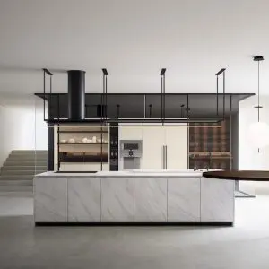 Modern kitchen with a white marble island, black cabinetry and a black extractor hood