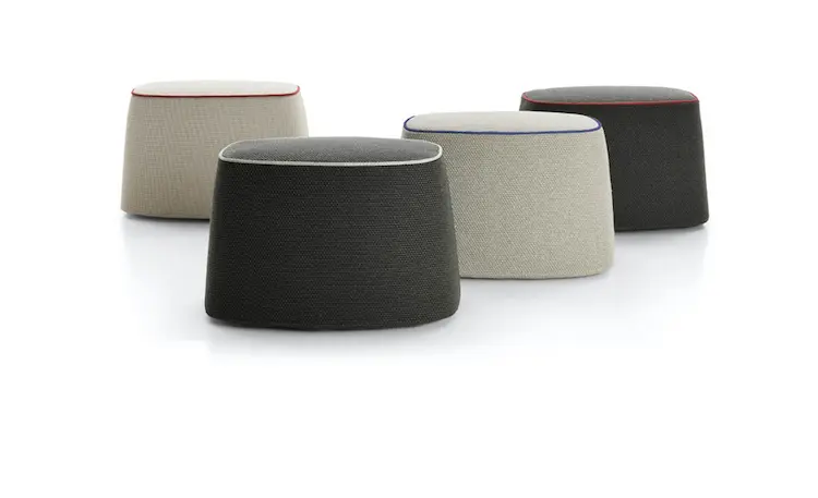 Four fabric outdoor poufs in beige and dark grey with contrast piping