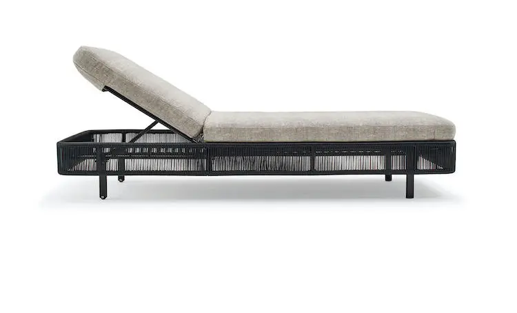 Adjustable outdoor sunbed with a black rope frame and beige cushion