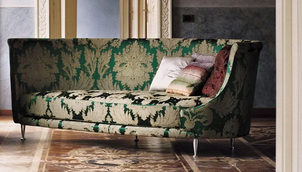 Moroso New Tone sofa upholstered in green and gold damask fabric on a patterned parquet floor