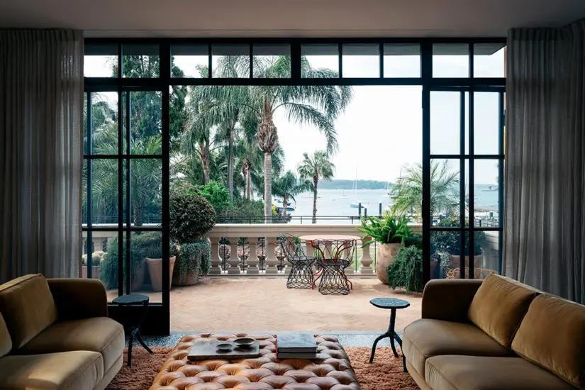 Elegant connection with the landscape: lounge area designed by Richard Stanish, one of the Design studios we selected in our list of the top interior designers Sydney has to offer