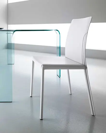 Dress chair designed by Archirivolto Design for Fiam, one of the italian furniture store you can find in Switzerland. Discover the luxury furniture Switzerland has to offer