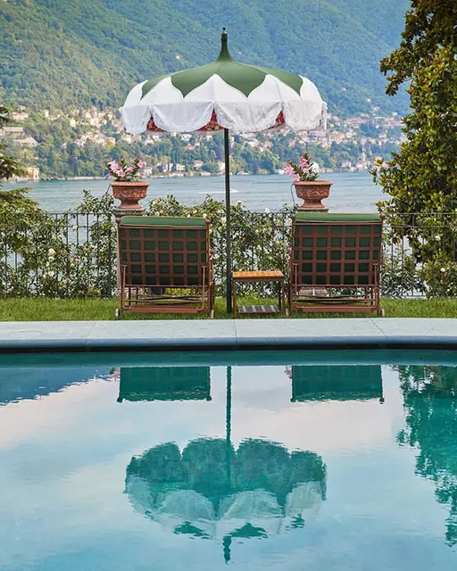 View from the pool looking over lake Como and the exterior furniture